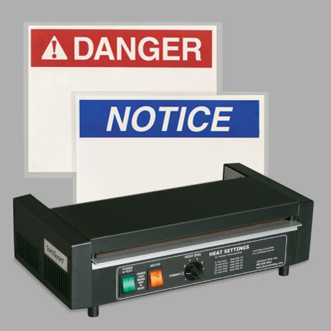 desktop laminating machine with DANGER and NOTICE signs behind it